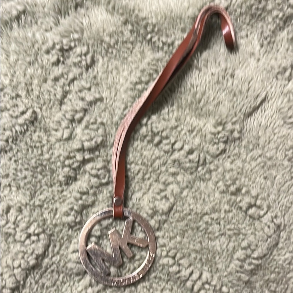 Michael Kors Silver and Brown logo charm/ hang tag